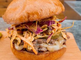 Krueger's ghost pepper jack cheeseburger with spicy homemade pickles and chipotle habanero slaw